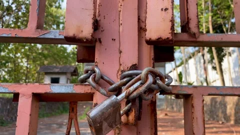 Close up of chain and gate padlock Stock Footage 250664917
