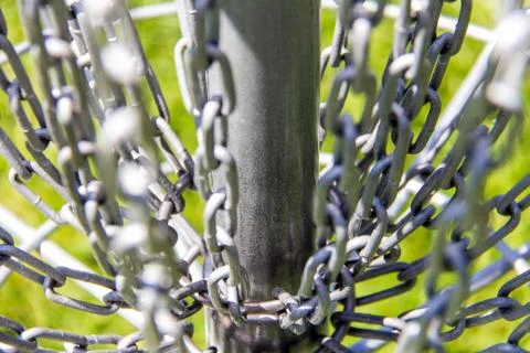 Close-up of the chains on a disc golf basket Stock Photos