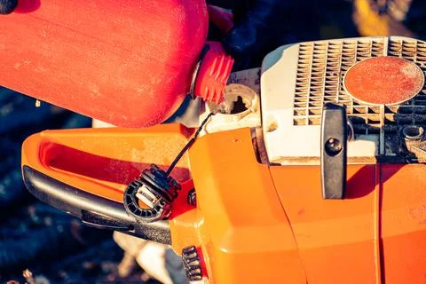 Close up of chainsaw being refueled Foto stock