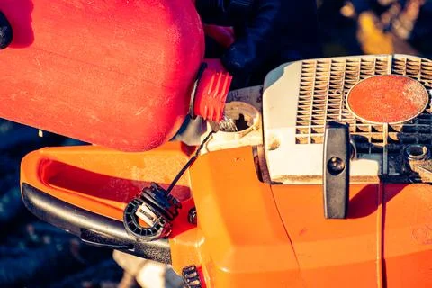 Close up of chainsaw being refueled Stock Photos