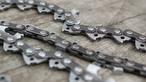 Close-up Chainsaw Chain on wood background Video stock 131313538