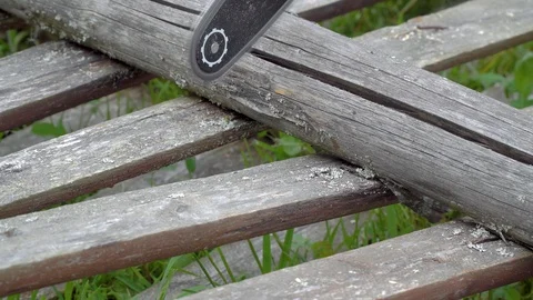 Close-up of chainsaw sawing a log or old fence Stock Footage 109065946