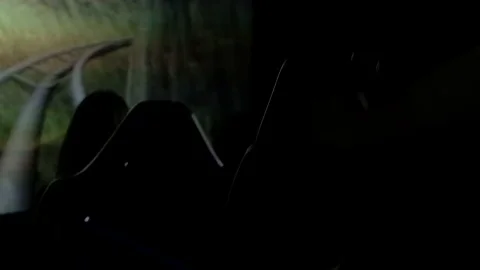 Close up of chairs silhouettes shaking in dark theater, motion on cinema screen. Stock Footage