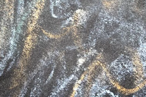 Close up of chalk pastel scribbles on a black paper background abstract Foto stock