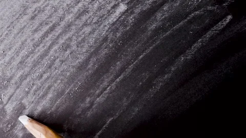 Close up of chalk pencil drawing on textured black paper. slow motion footage Stock Footage 340906311
