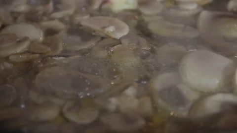 Close-up, Champignon mushrooms when cooked in a pan Stock Footage 121330267