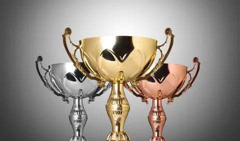 Close up champion silver trophy on gray background Stock Photos