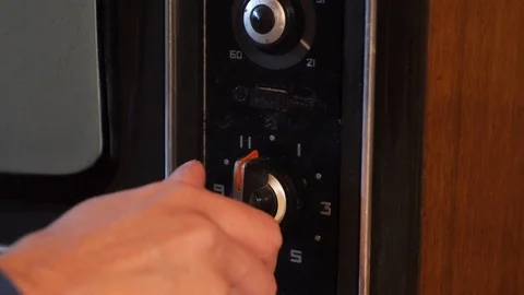 Close up of channel switching on an old TV Stock Footage 102701706