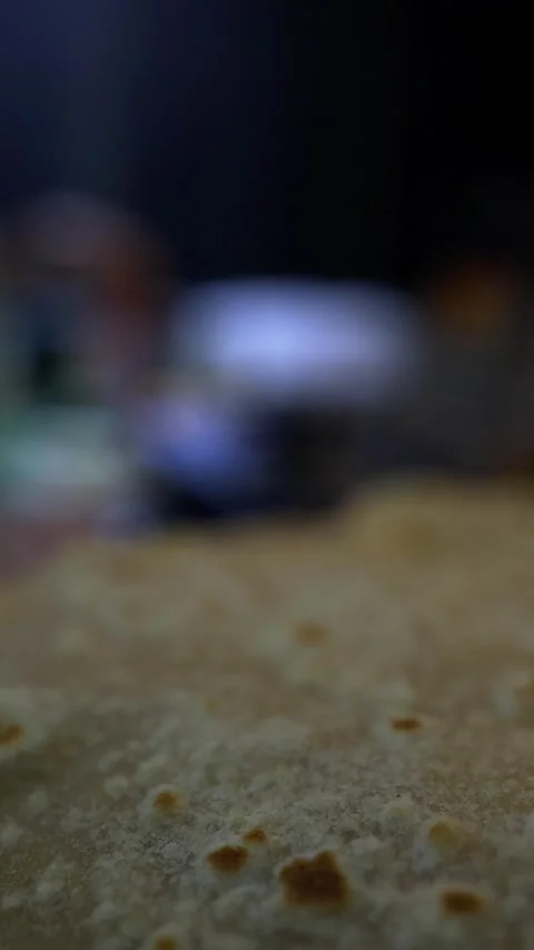 Close-up of chapati flatbread with blurred kitchen background Stock Footage 343876416