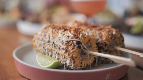 Close Up of Char Grilled Mexican Corn on the Cob with Fresh Garnish 스톡 동영상 305022104