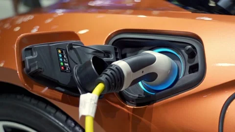 Close Up charging Electric Vehicle modern car at electric charging station 動画素材 145961953