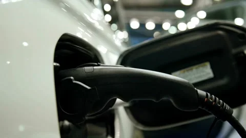 Close-up Charging modern electric car on the street, concept future of the Stock-Footage 336585534