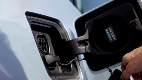 Close-up Charging modern electric car on the street, concept future of the Video stock 336585577