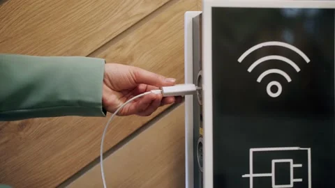Close up of charging smartphone at the shopping centre or terminal airport Stock Footage 161991149