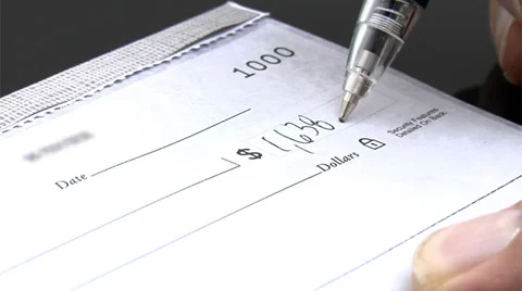 Close up of check being signed Stock Footage 32709104