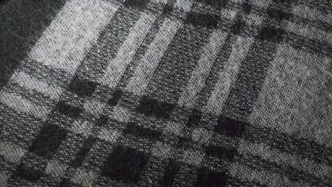 Close-up of checkered acrylic or wool fabric, women's sweater or scarf Stock-Footage 122594100