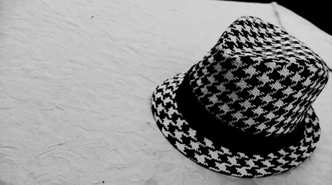 Close up checkered hat on a table Stock Footage 34560156