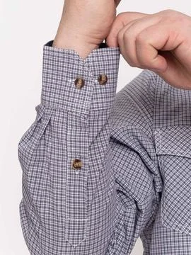 Close up of checkered shirt cuff buttons with hand Stock Photos