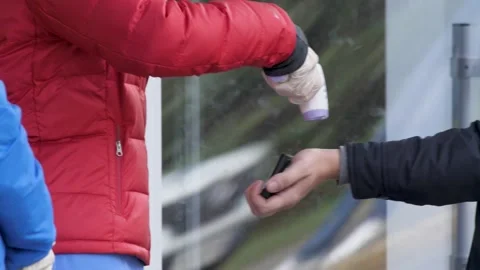 Close Up. Checking health Using Infrared Thermometer of People in Queue at Video stock 141944765