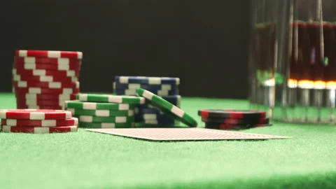 A close-up of checking poker pair of cards. Two red aces. Chips on a background. Stock Footage 139654236