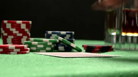 A close-up of checking poker pair of cards. Two red aces. Chips on a background. Stock Footage 205376015
