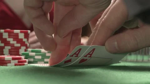 A close-up of checking poker pair of cards. Two red aces. On the background sexy Stock Footage 205376060