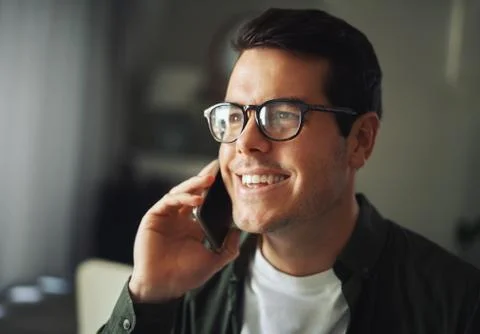 Close-up of a cheerful man talking on mobile phone Stock Photos