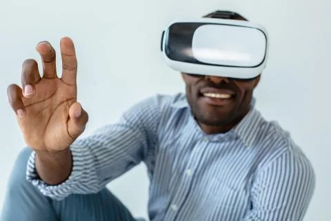 Close up of cheerful man using VR glasses Stock Photos