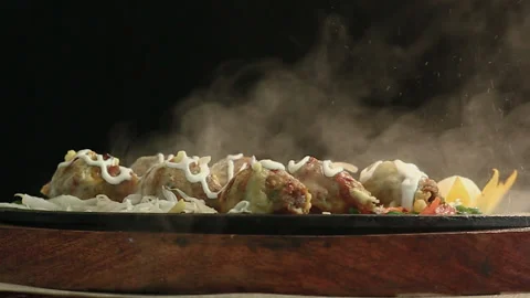 Close-Up Cheese Chicken BBQ Kebab on Round Table with Smoke Black Background Stock Footage 200953142