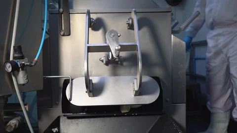 Close-up of cheese flow out from a machine Stock Footage 129928148