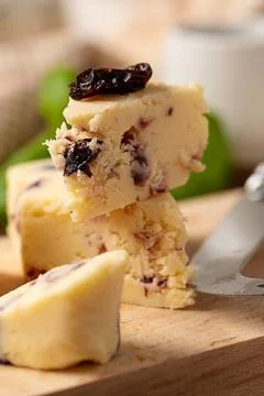 Close up cheese slices with berries. Rustic background Stock Photos
