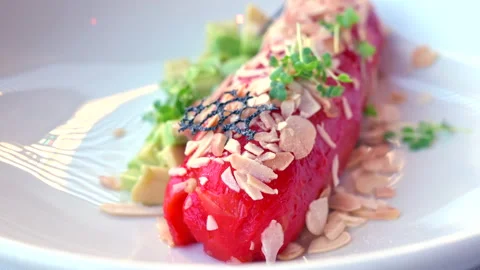 Close up of a cheese stuffed red pepper in a white plate at a restaurant Stock Footage 171625084