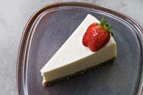 Close up cheesecake with strawberry on grey table. top view Stock Photos