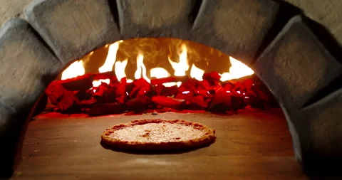 Close up of cheesy pizza being cooked in traditional stone oven. Italian pizza Video stock 162520791