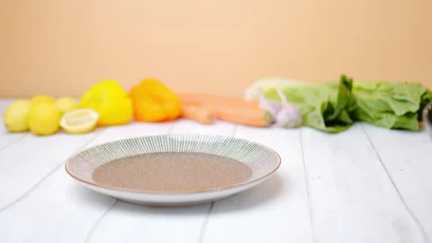 Close-up of a chef arranging creamy scallops in a serving plate in 4K. Stock Footage 138067625
