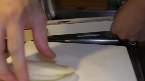 Close-Up of Chef Arranging Thinly Sliced White Onion on Cutting Board Video stock 347689368