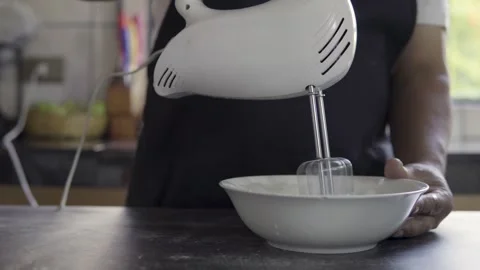 Close up chef beating eggs with an electric mixer  Stock Footage 272496140