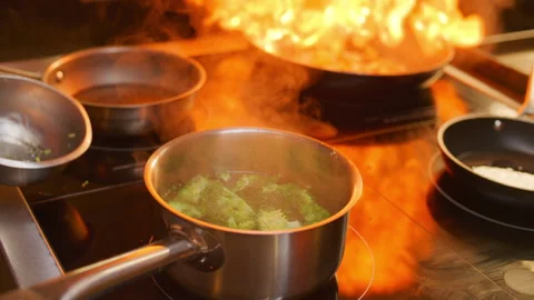 Close Up of Chef Boiling Fresh Broccoli in Pot on Stove in Restaurant Kitchen Видео 330062036