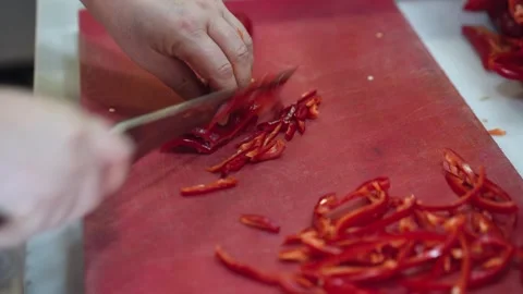 Close-up of a chef chopping red peppers Stock Footage 294955815