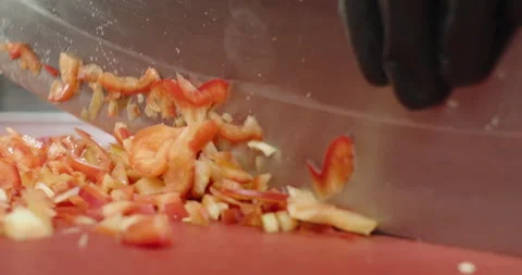 Close-up chef chops red bell pepper with an axe on a cutting board. Male hands Stock Footage 271635585