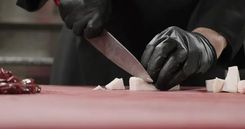 Close-up chef chops sheep tail fat on a cutting board to prepare liver kebab Stock Footage 274364324