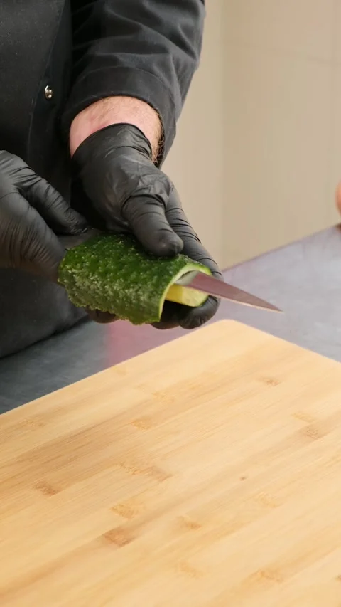Close up of Chef cook hands chopping vegetables for traditional Asian cuisine Stock Footage 262580909