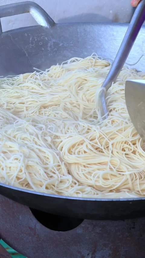 Close up chef cooking fried noodle in pan, street food, Bangkok Thailand. Stock Footage 305444670