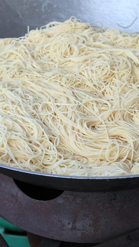 Close up chef cooking fried noodle in pan, street food, Bangkok Thailand. Stock Footage 305446216