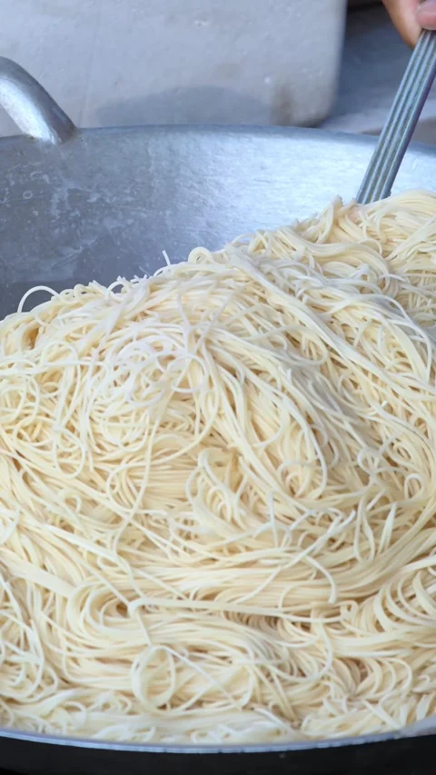 Close up chef cooking fried noodle in pan, street food, Bangkok Thailand. Stock Footage 305550953