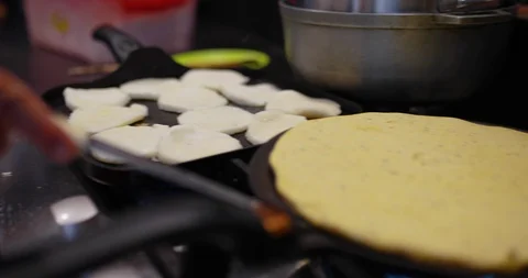 Close up of chef cooking pancake on flat pan, Barichara, Colombia Stock Footage 135296267