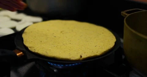 Close up of chef cooking pancake on flat pan, Barichara, Colombia Stock Footage 135296391