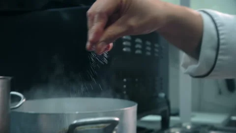 Close up chef cooking seafood, add salt Stock Footage 201026776