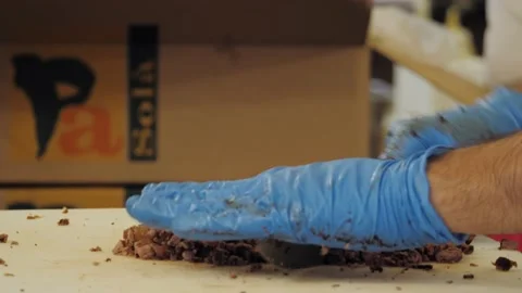 Close up of chef cutting baked beef into slices with knife on cutting board Stock Footage 221861673