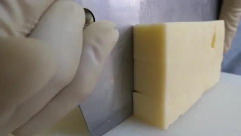 Close Up of Chef Cutting Block of Cheese with Bench Scraper Video stock 343587573